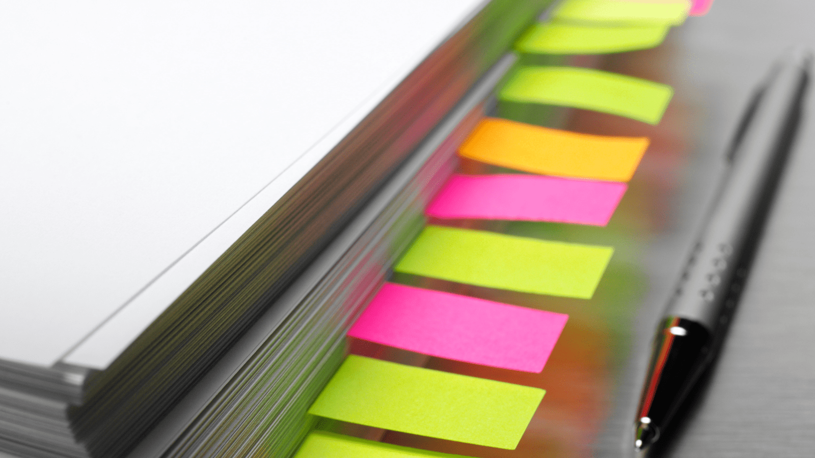 time saving. Image of a notebook with brightly coloured dividers