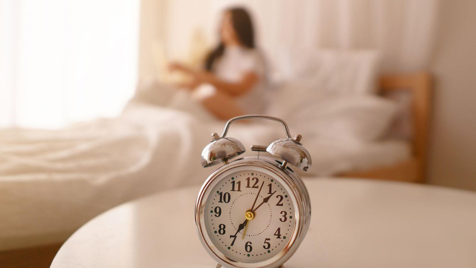 bedtime rituals to help you sleep image of blurred woman and clock