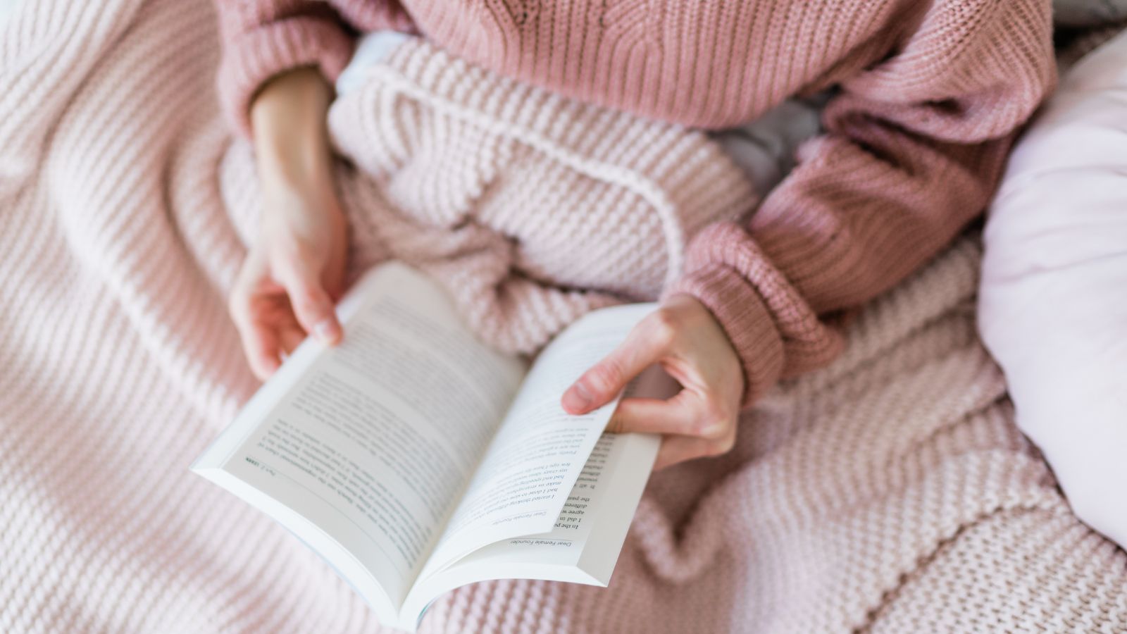 How to have a calmer Christmas. Take time for yourself. Image of woman in pink reading