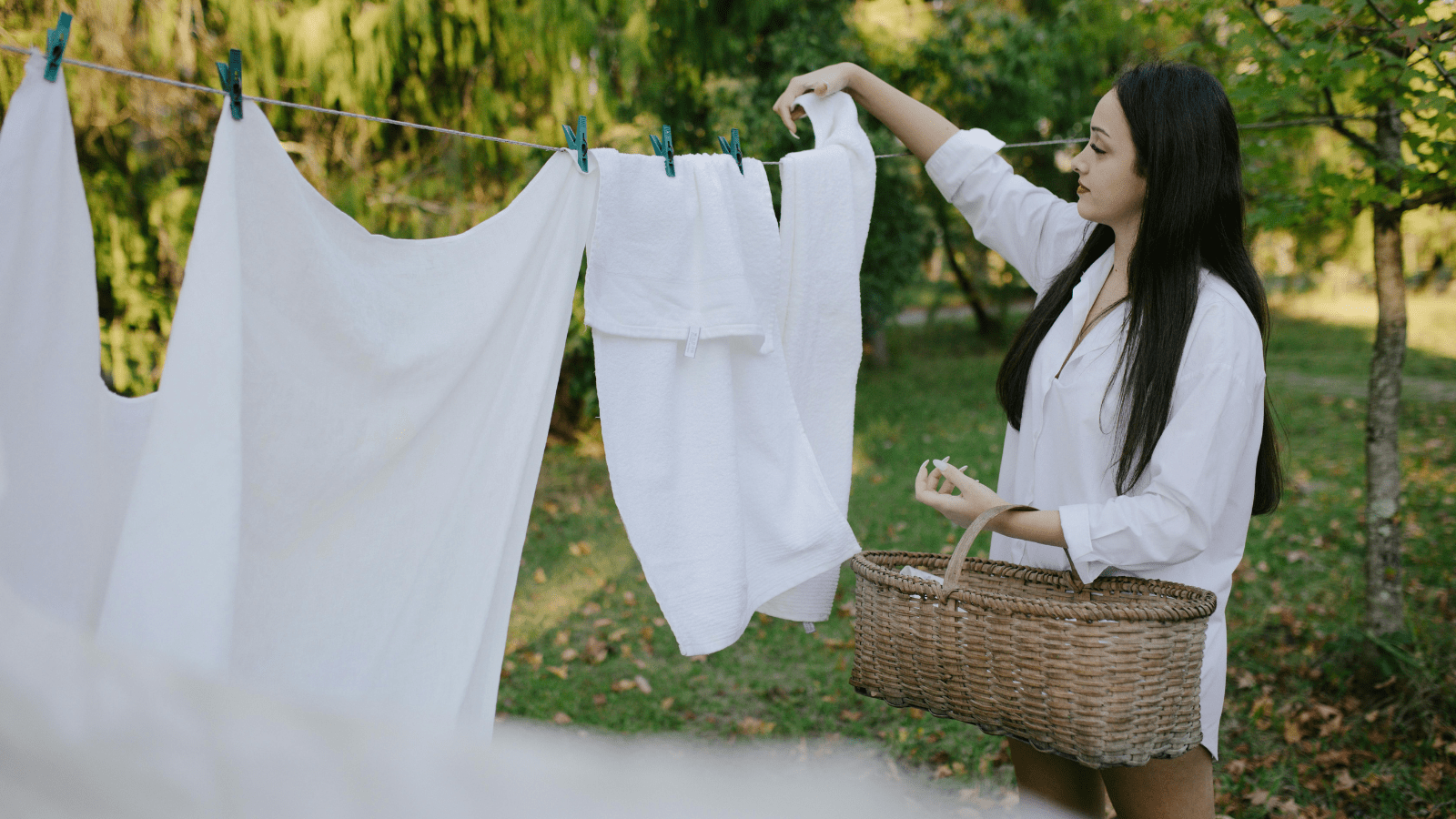 Calm the chaos do a load of laundry every day calm the chaos do a load of laundry each day image of a lady hanging out white items on a washing line