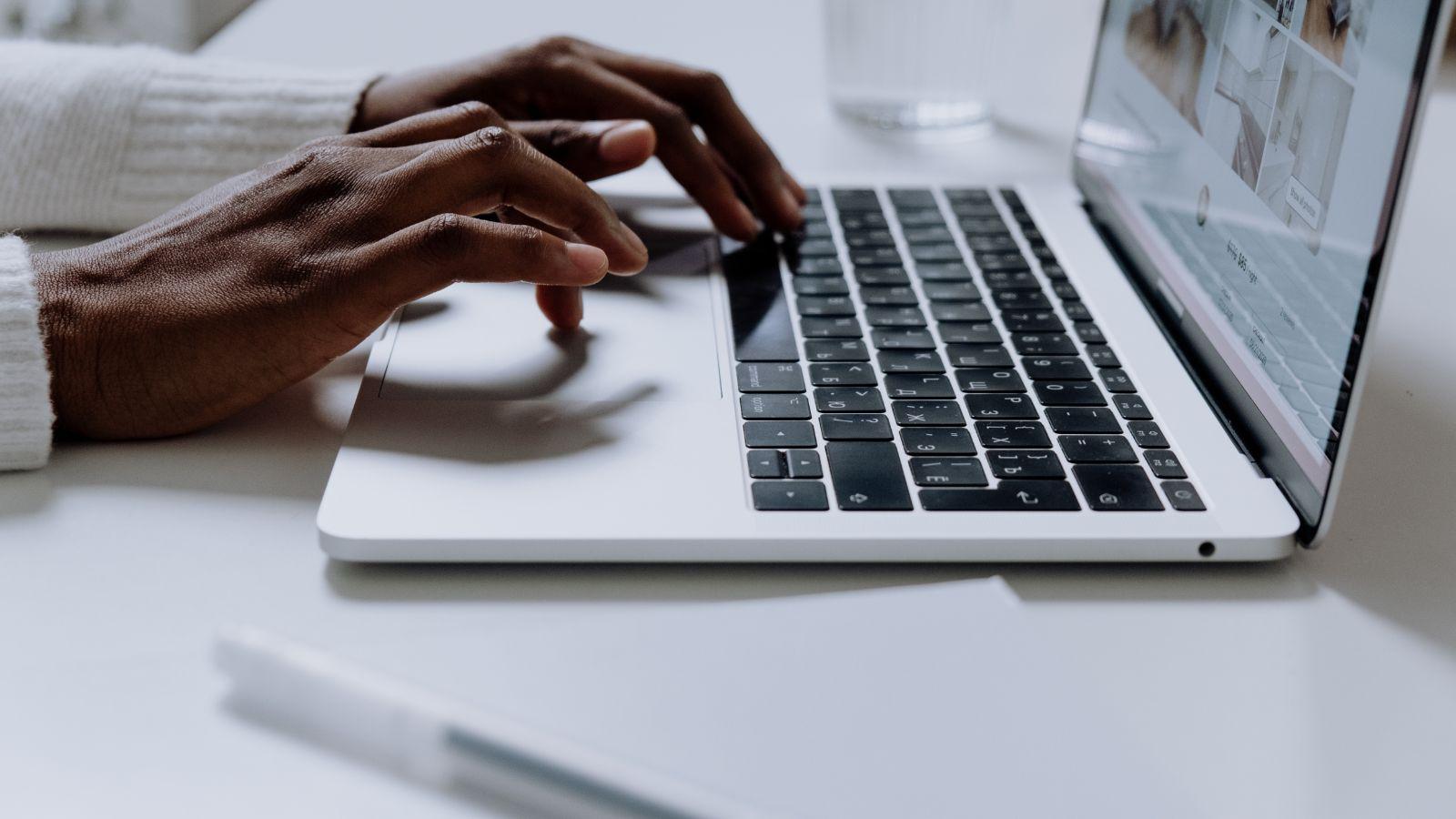 Calm the chaos do emails as a batch calm the chaos, image of hands typing on a laptop