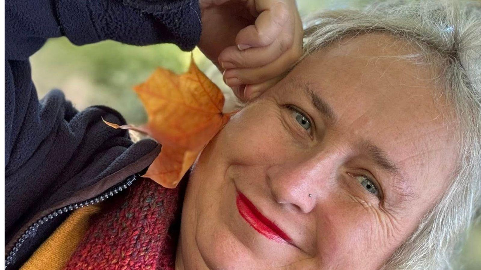 image of playing with an autumn leaf