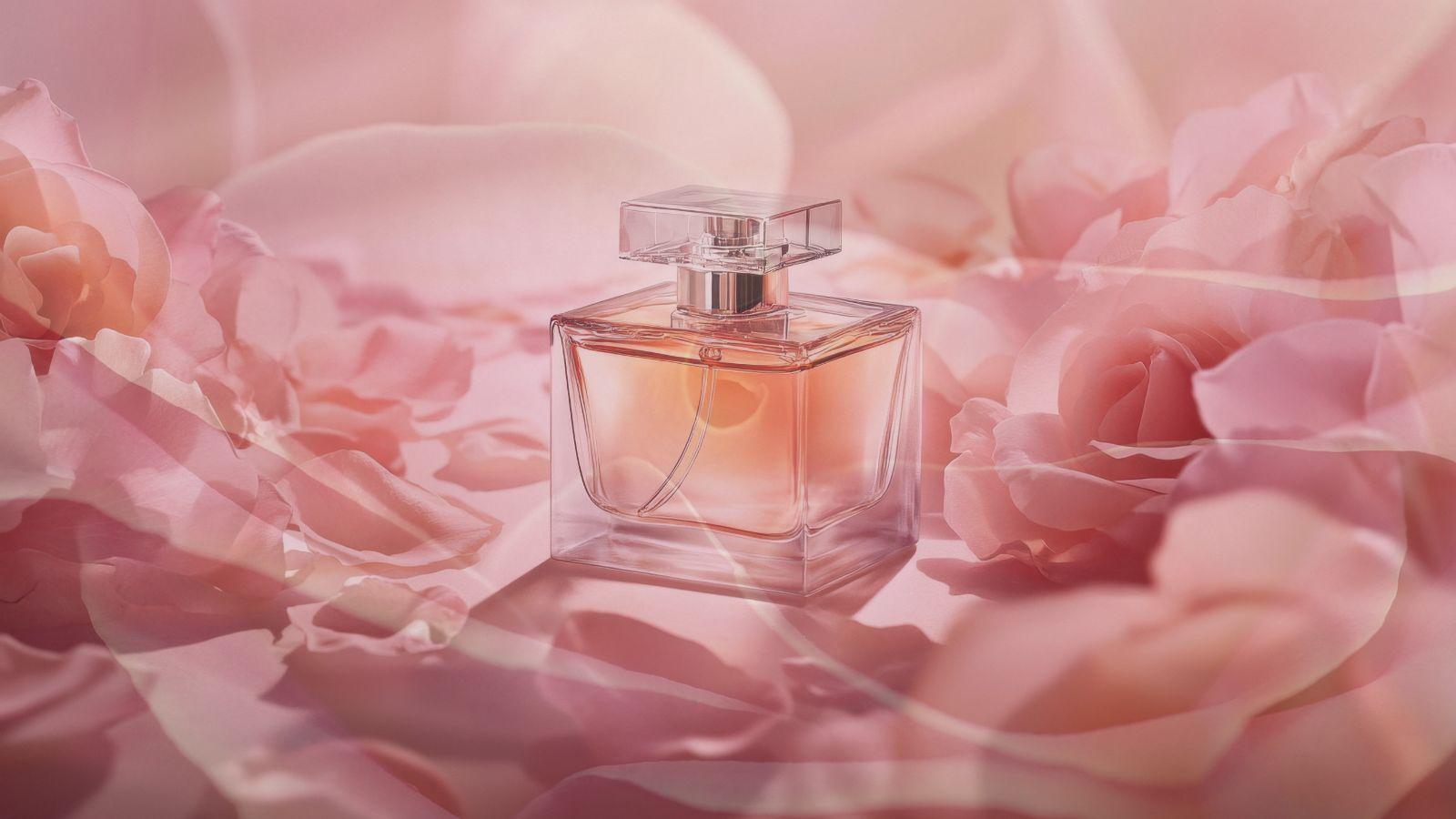 image of a bottle of perfume on a bed of rose petals to illustrate being a goddess