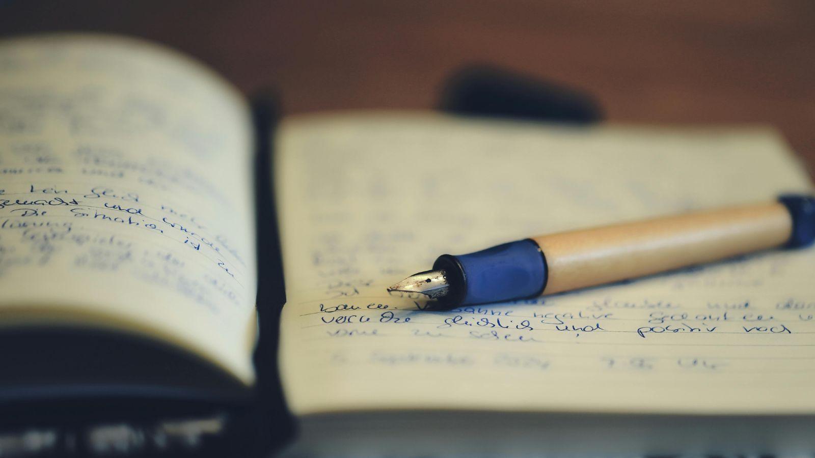 creative image of pen and notebook 