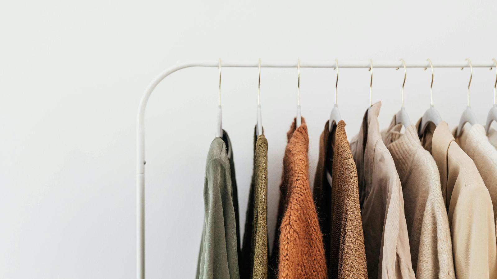 autumn reset prune anything that no longer sparks joy in your life, image of a rail of clothes